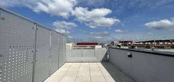 Erstbezug: Helle DG-Wohnung mit atemberaubendem Ausblick und großzügiger Dachterrasse