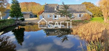 Magnifique propriété avec longère rénovée avec 3 chambres, piscine couverte, 16 hectares de terrain dont bois