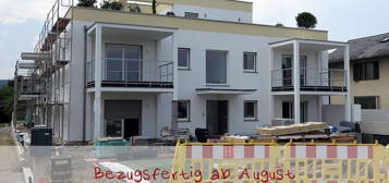 Erstbezug: Lichtdurchflutete Wohnung für Singles oder Paare - inkl. Balkon und TG-Parkplatz