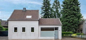 Einfamilienhaus mit Ladenlokal mit Garten, Werkstatt,  Garage und Stellplätzen in Mülheim - Speldorf