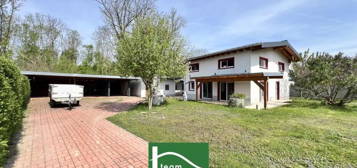 Spacious, low-energy house with an additional office/practice or apartment of 70 m². Unique location, large corner lot & privat (near forest and meadows)! - JETZT ZUSCHLAGEN