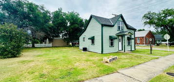 210 E 1st St, Lucas, KS 67648