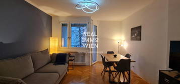 READY TO LIVE- MÖBLIERTES SERVICED APARTMENT MIT BALKON. NAHE LAKESIDE PARK, UNI UND CITY. PROVISIONSFREI