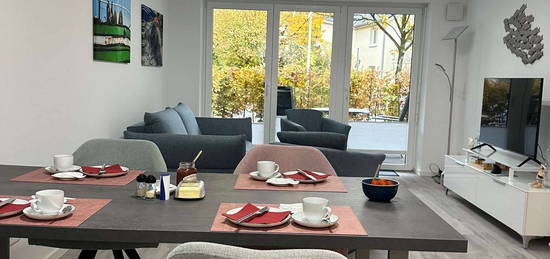 Geschmackvolle 2,5-Zimmer-EG-Wohnung mit gehobener Ausstattung, TG-Stellplatz, Terrasse und EBK