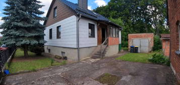 Familienhaus "Stralsund 83 G" mit ausgebauten Dachgeschoss und Naturpool in Gossel