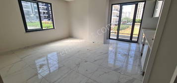 7204-15,000TL ALANYA MAHMUTLARDA  MAHMUTLAR LK OKUL CVARINDA 2+1  BO DARE 90 M2 KRALIKTIR