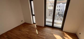 SPECIAL OFFER: ERSTBEZUG im NEUBAU 2024: 1-Zi-Whg, 27 m² - VHS 1. OG mit SÜDSEITE + 25 m² TERRASSE