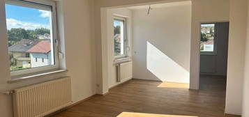 Moderne, helle, 2-Zimmer Wohnung in zentraler Lage mit Eigengarten