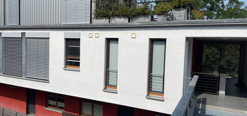 Einzigartige Maisonette-Wohnung mit sonniger Dachterrasse