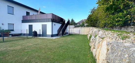 Neubauwohnung mit Garten, Terrasse und Garage in traumhafter Lage