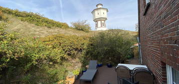 Blick auf den Wasserturm Haus in den Dünen von Langeoog