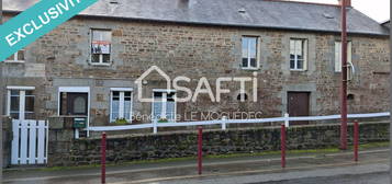 Longère en pierre à  rénover, garages et cellier- centre bourg.