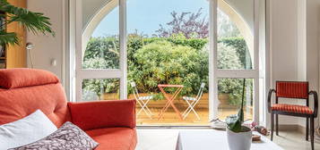 Appartement en rez de jardin avec terrasse dans un ancien corps de ferme