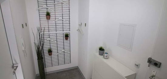 Vollmöbliertes Apartment mit Balkon + Tiefgaragenparkplatz