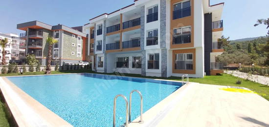 KUŞADASI DAVUTLAR ACİL SATILIK HAVUZLU SİTE DE 2+1 YENİ DAİRE