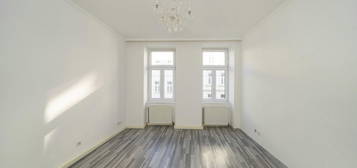 2 Zimmer Wohnung: Perfekt für Singles oder Paare – gut angebunden, saniert und mit Stil!